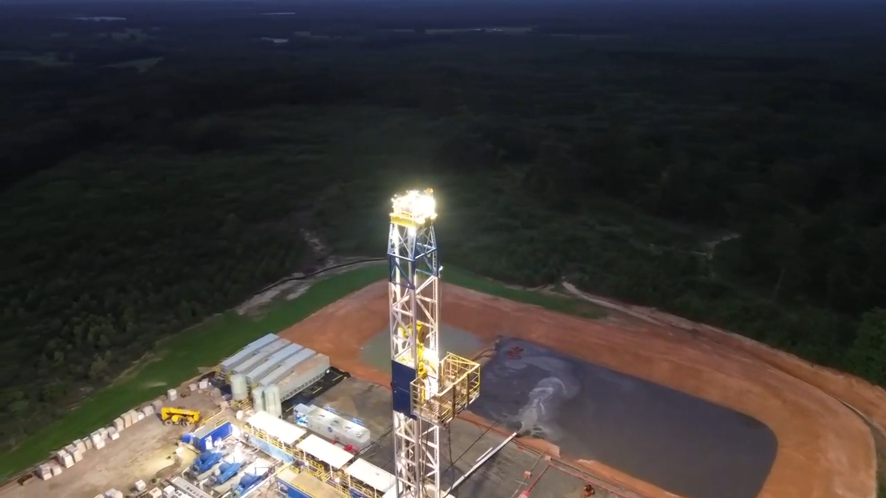 Patterson 586 rig on the Red Gentry pad at dusk